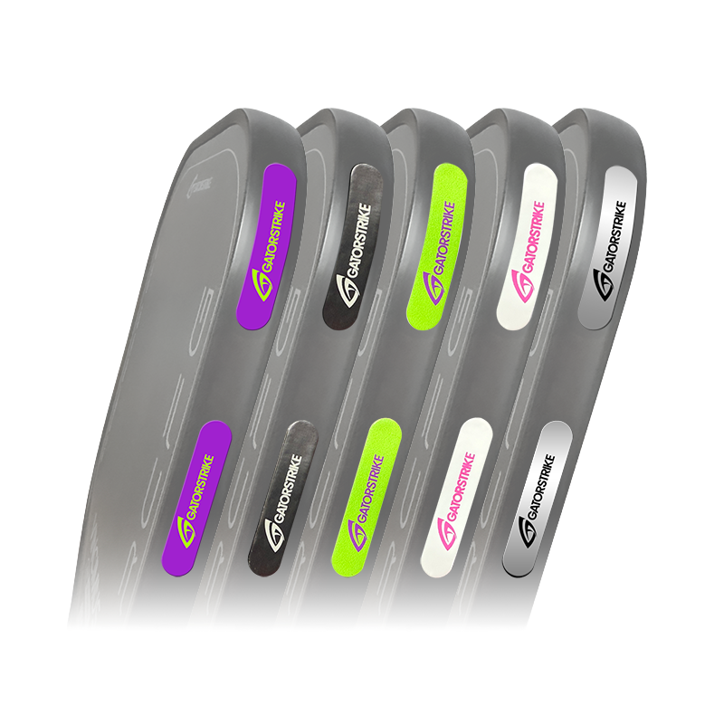 Five gray Goostrike products stand upright in a row, each with a differently colored accent: purple, green, white, neon yellow, and black. The Goostrike logo is visible on each.