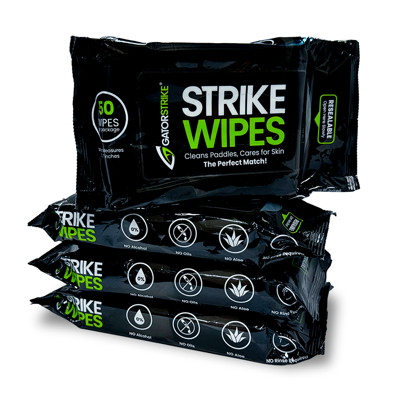 Four packs of black GatorStrike Strike Wipes, labeled for cleaning paddles and skin. Each pack contains 50 wipes and highlights features like no alcohol, no oils, and no rinse needed.