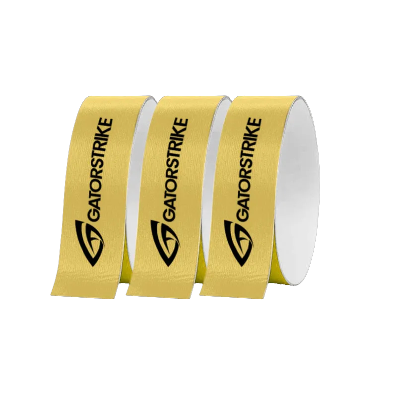 Three rolls of GATORSTRIKE yellow protective tape stand upright, each featuring the brand name and black logo vertically. Displayed on a white background, this paddle edge protector is ideal for securing your pickleball equipment.