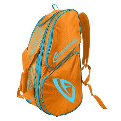 The GATORSTRIKE™ World Tour Backpack Bag features orange and blue colors, logo and text on the side and top, multiple zippered compartments, and adjustable shoulder straps for secure equipment protection.