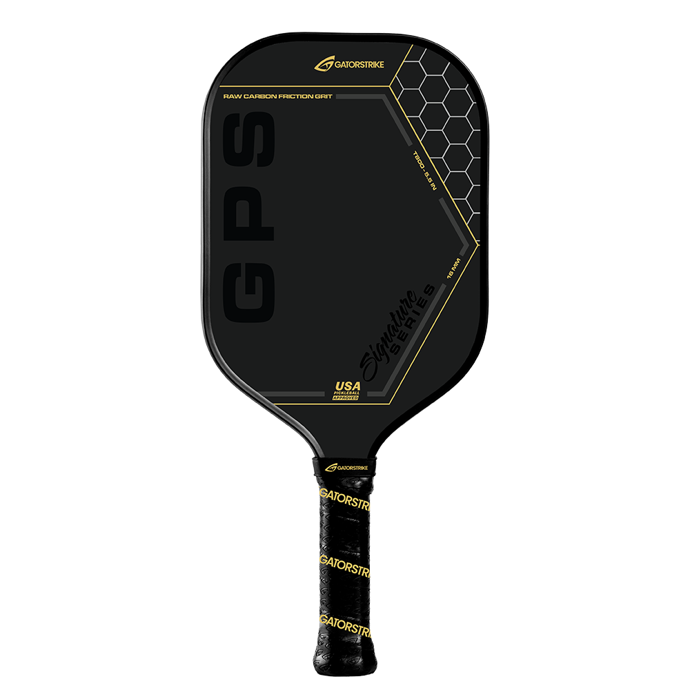 The GATORSTRIKE™ Gold Pro Series paddle features a black carbon fiber face with gold accents, hexagon patterns, GPS and Signature Series text, plus a black grip wrapped in yellow GATORSTRIKE branding for enhanced style and control.