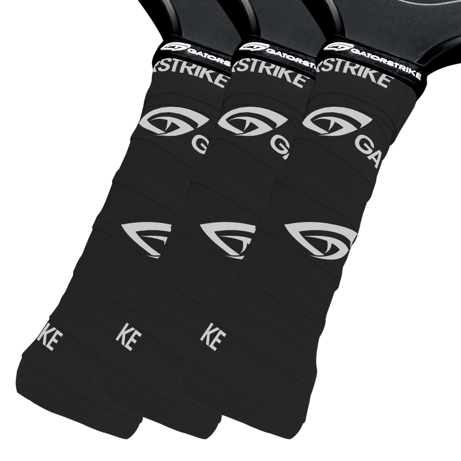 Close-up of three black GATORSTRIKE paddle overgrips overlapping diagonally. Each grip features the brand name in white and textured horizontal lines, ensuring a secure hold during play.