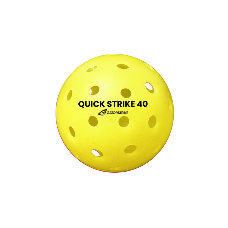 A yellow GATORSTRIKE™ Quick Strike Pickleball with multiple holes and black QUICK STRIKE 40 and GATORSTRIKE labels, designed for top consistency in competitive play, shown on a plain white background.