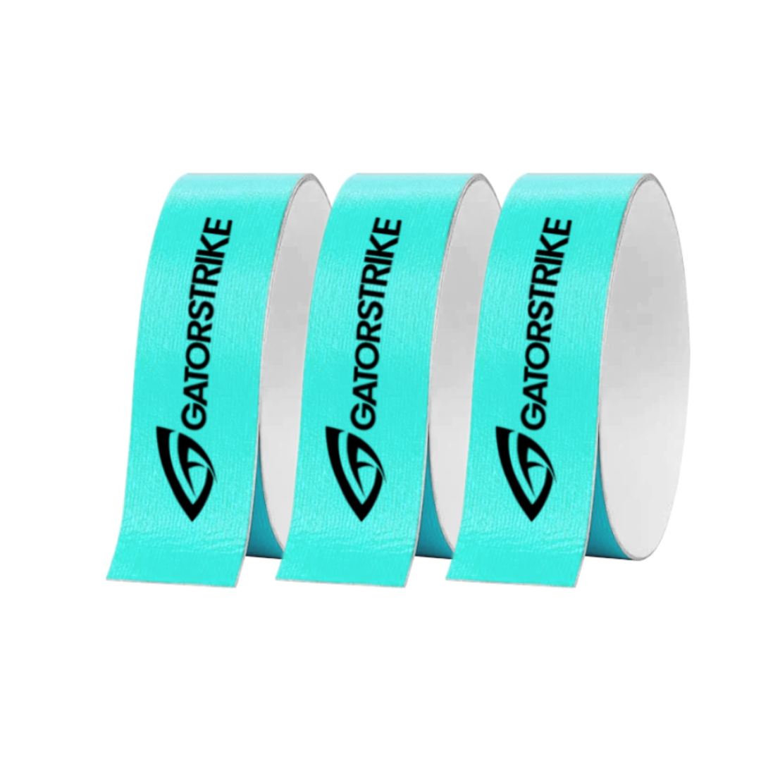 Three upright rolls of light blue GATORSTRIKE tape are seen on a white background. Each features the black GATORSTRIKE logo and vertical text, providing reliable paddle edge protection.